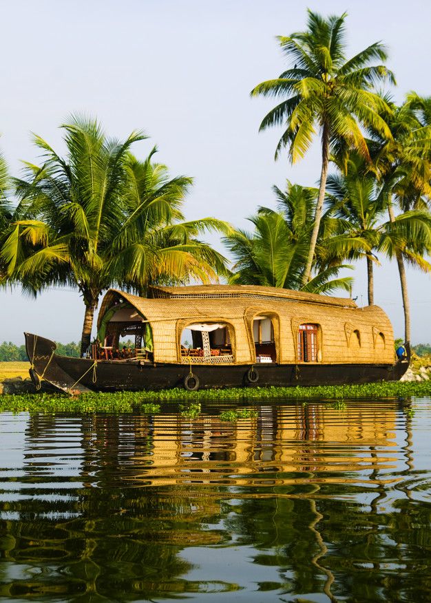enjoy cruising in houseboats through kumarakom backwaters